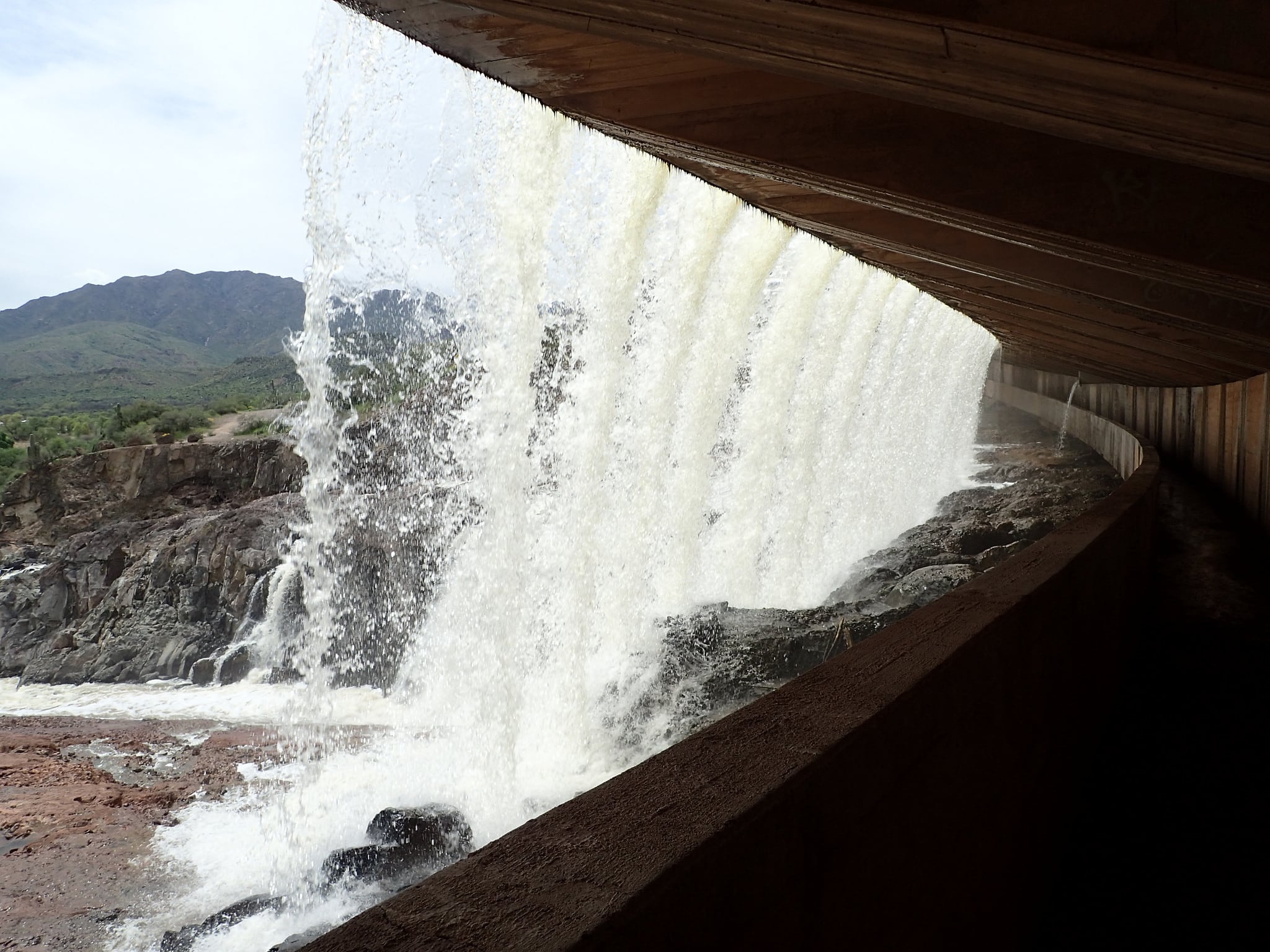 Walking behind a waterfall at Horseshoe Dam • rscottjon.es